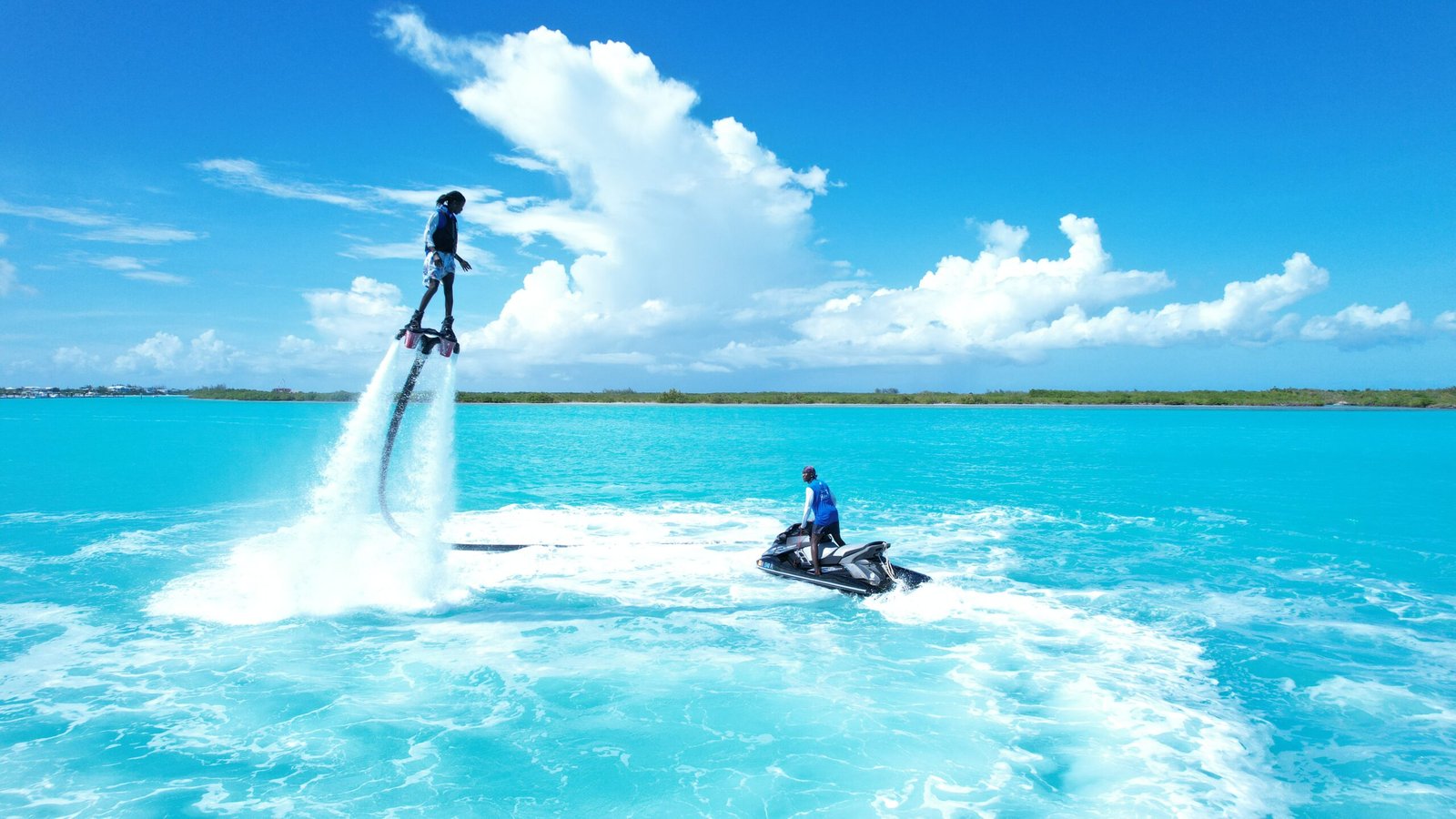 Adrenaline-packed moment as rider launches high over the ocean spray.